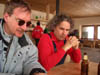 Piero e Giampaolo seduti in baita attendono di mangiare un meritato pranzo...